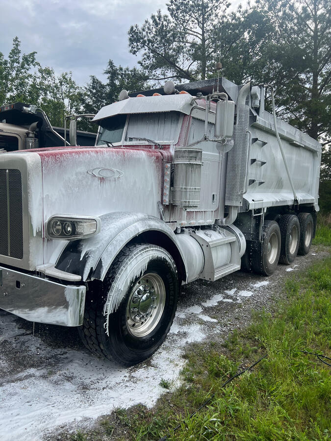 Washing peterbilt dump truck by shiny side up truck wash