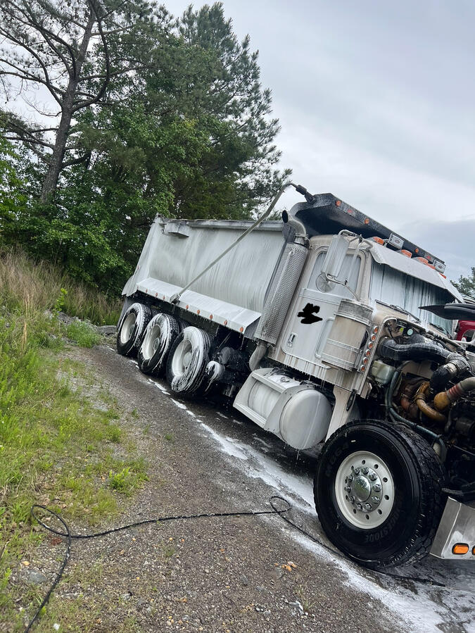 Washing peterbilt dump truck by shiny side up truck wash