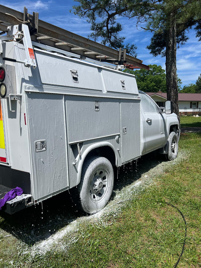 Service truck washed by shiny side up mobile truck wash